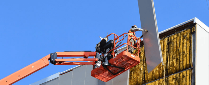 Red Direct energy-efficient metal buildings featuring reflective roofing, insulated wall systems, and rooftop solar panels