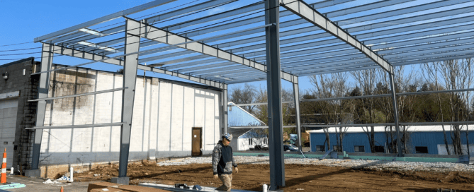 Red Direct steel construction project management team coordinating the erection of a pre-engineered metal building