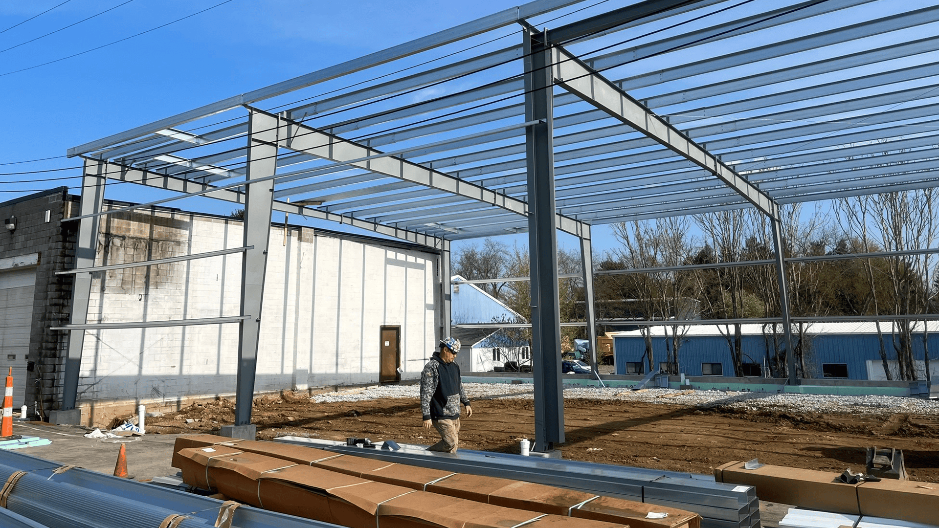 Red Direct steel construction project management team coordinating the erection of a pre-engineered metal building