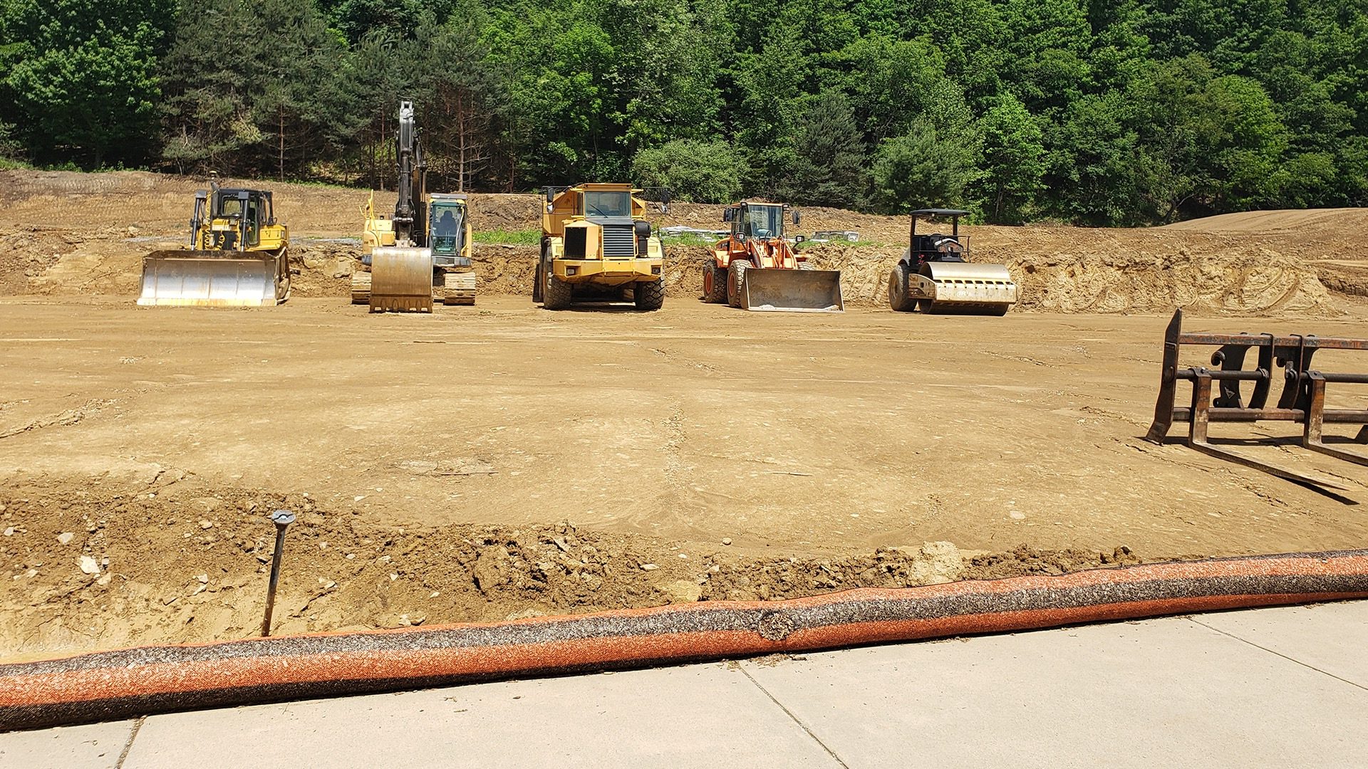 Steel midstream natural gas infrastructure facility with industrial equipment and pipeline support systems