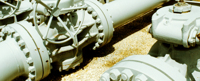 Steel compressor station building supporting midstream natural gas infrastructure with industrial compression equipment