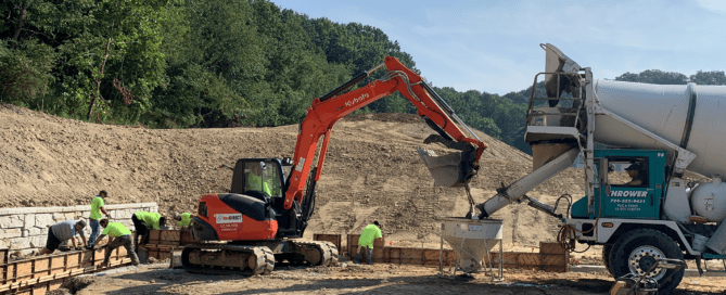 Steel pipeline support building housing compressor equipment at a midstream infrastructure facility with protective structural design