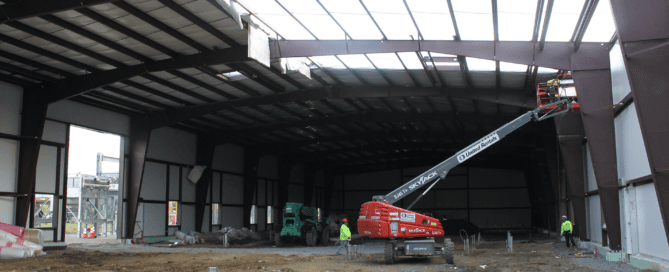 Red Direct steel cultural facility featuring modern architecture and flexible gathering spaces for museums, performance venues, and community events
