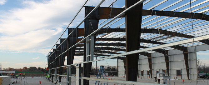 Red Direct clear-span steel building selected to support commercial or industrial business operations