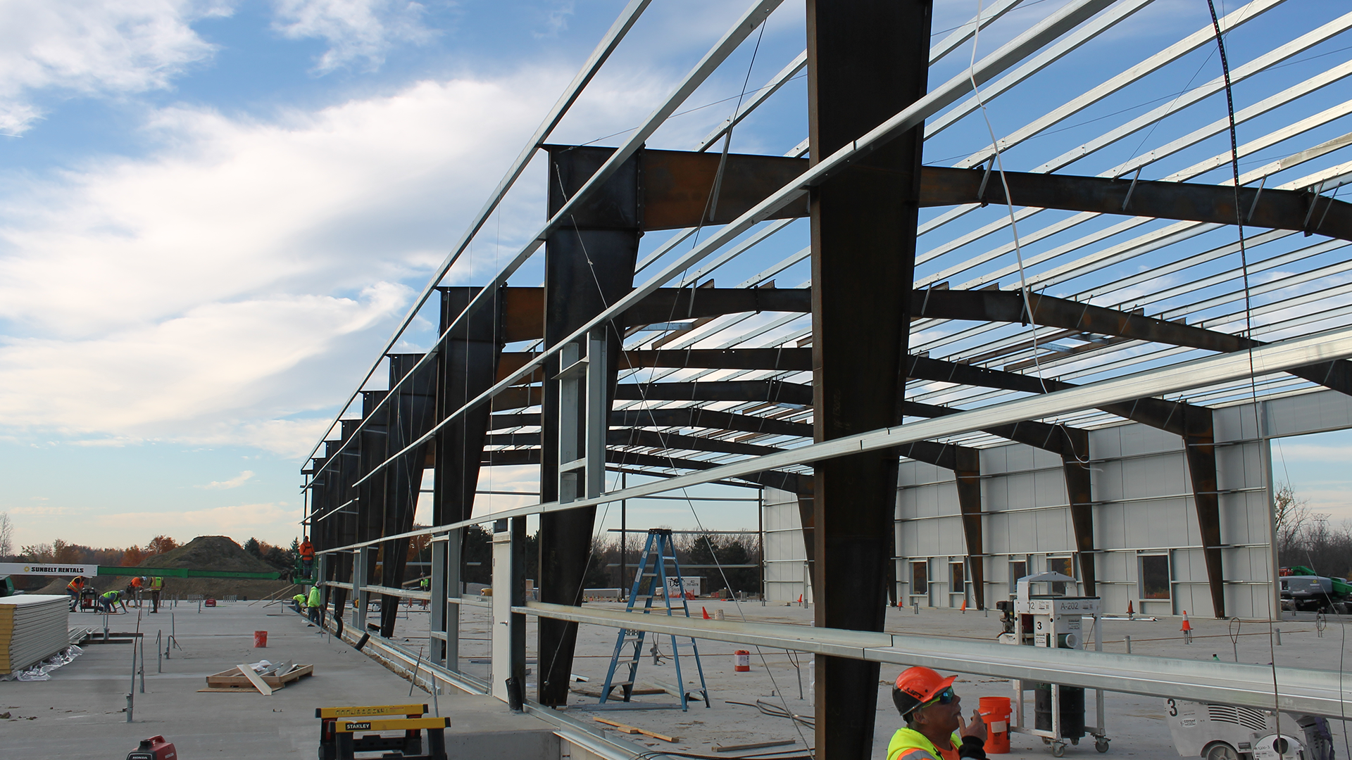 Red Direct clear-span steel building selected to support commercial or industrial business operations