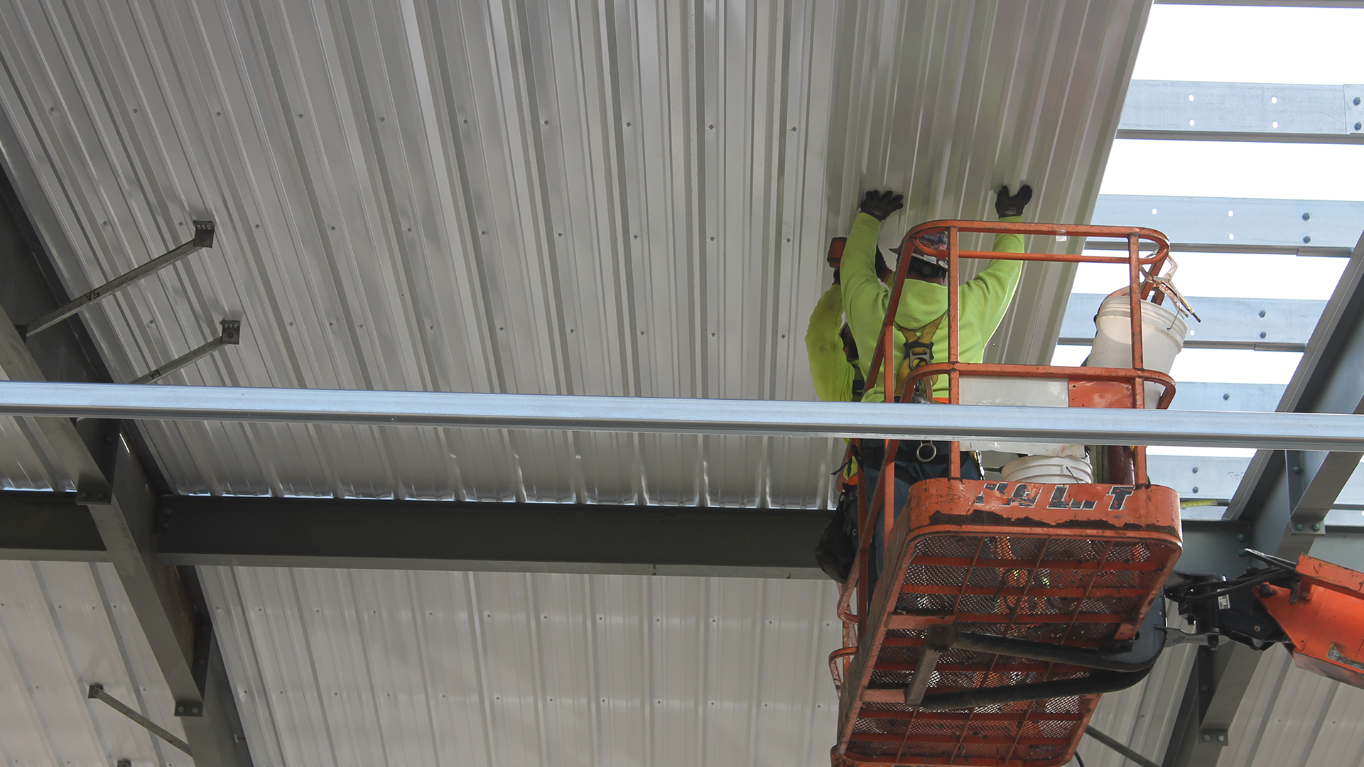 Red Direct custom steel building featuring coordinated exterior finishes, windows, entrances, and operational design options