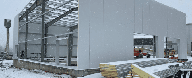 Red Direct cold weather steel building engineered for snow load performance