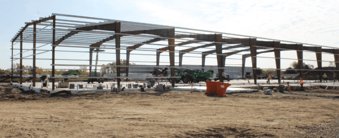 Steel metering station building protecting natural gas infrastructure equipment and midstream pipeline systems