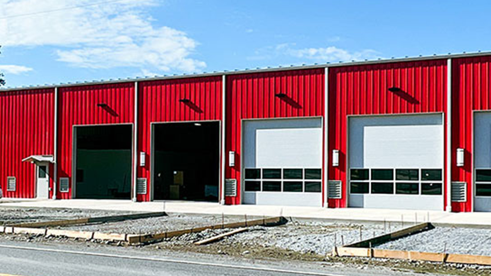 Steel municipal infrastructure building designed for fire stations, service garages, and public works facilities