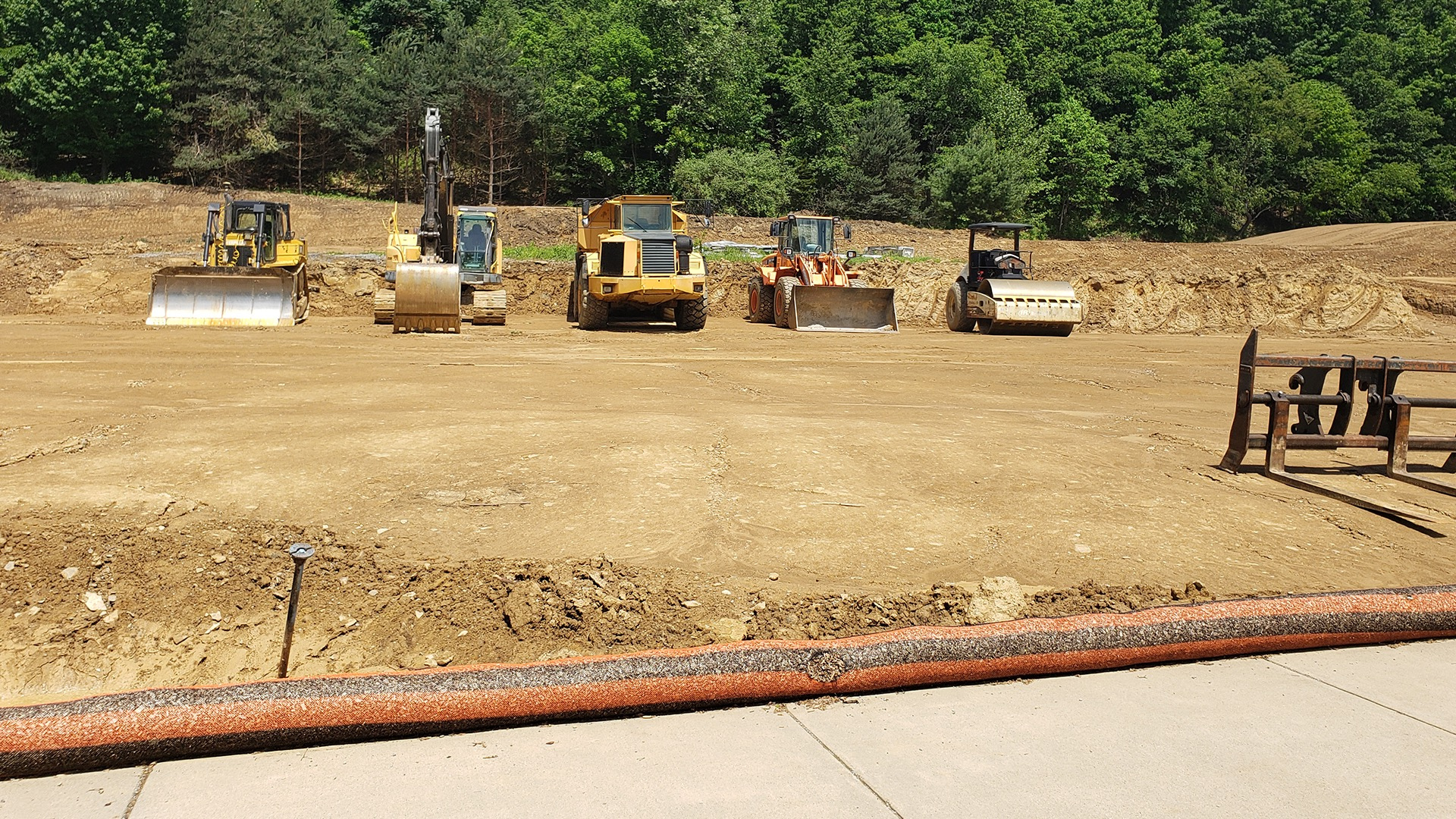 Steel midstream natural gas infrastructure facility with industrial equipment and pipeline support systems