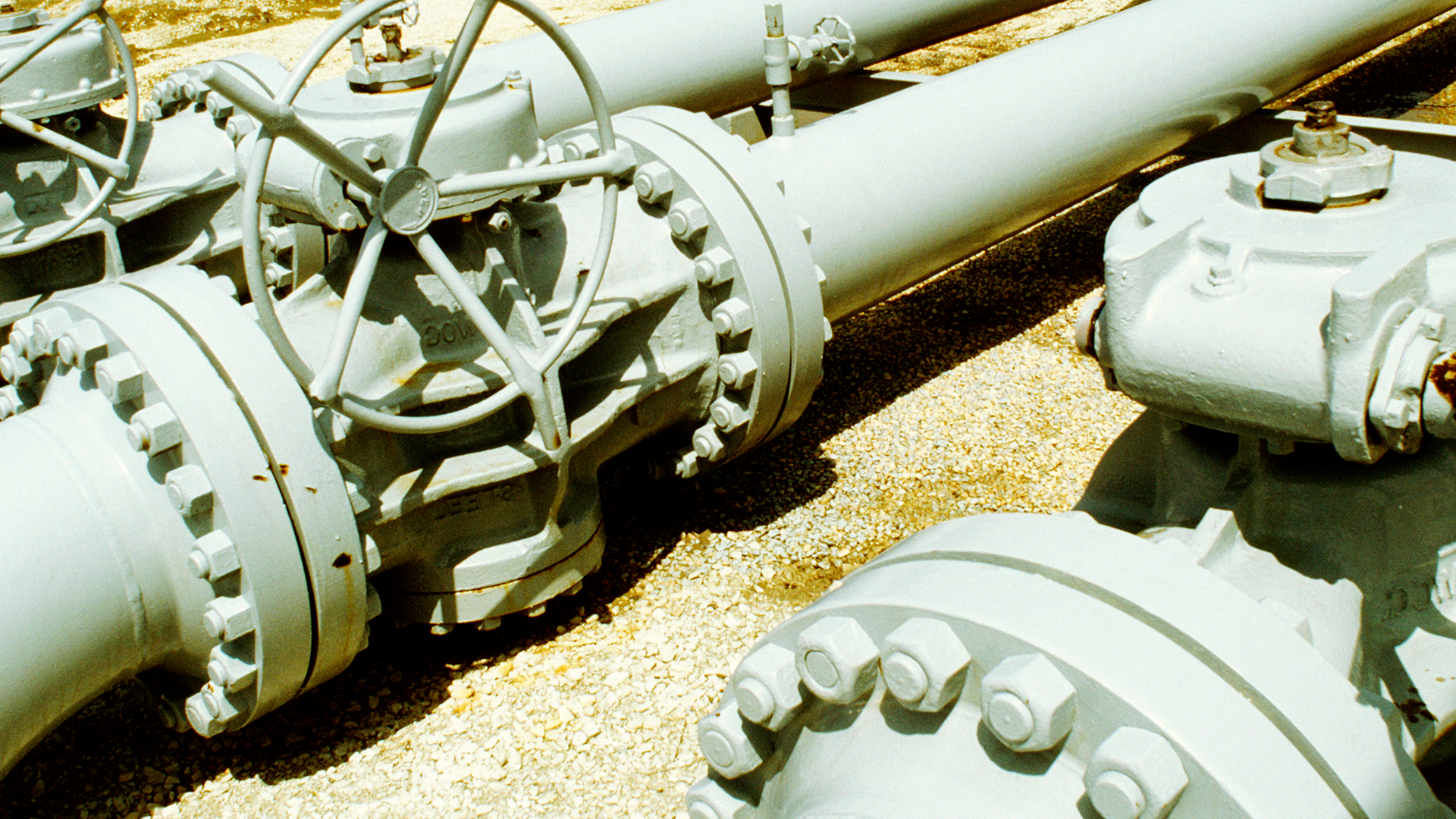 Steel compressor station building supporting midstream natural gas infrastructure with industrial compression equipment