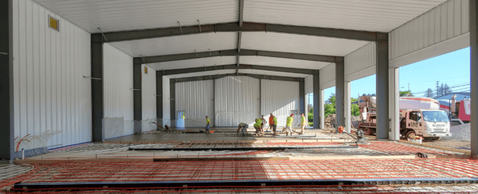 Red Direct steel sports facility featuring a modern clear-span athletic building designed for gyms, sports complexes, and indoor recreational facilities