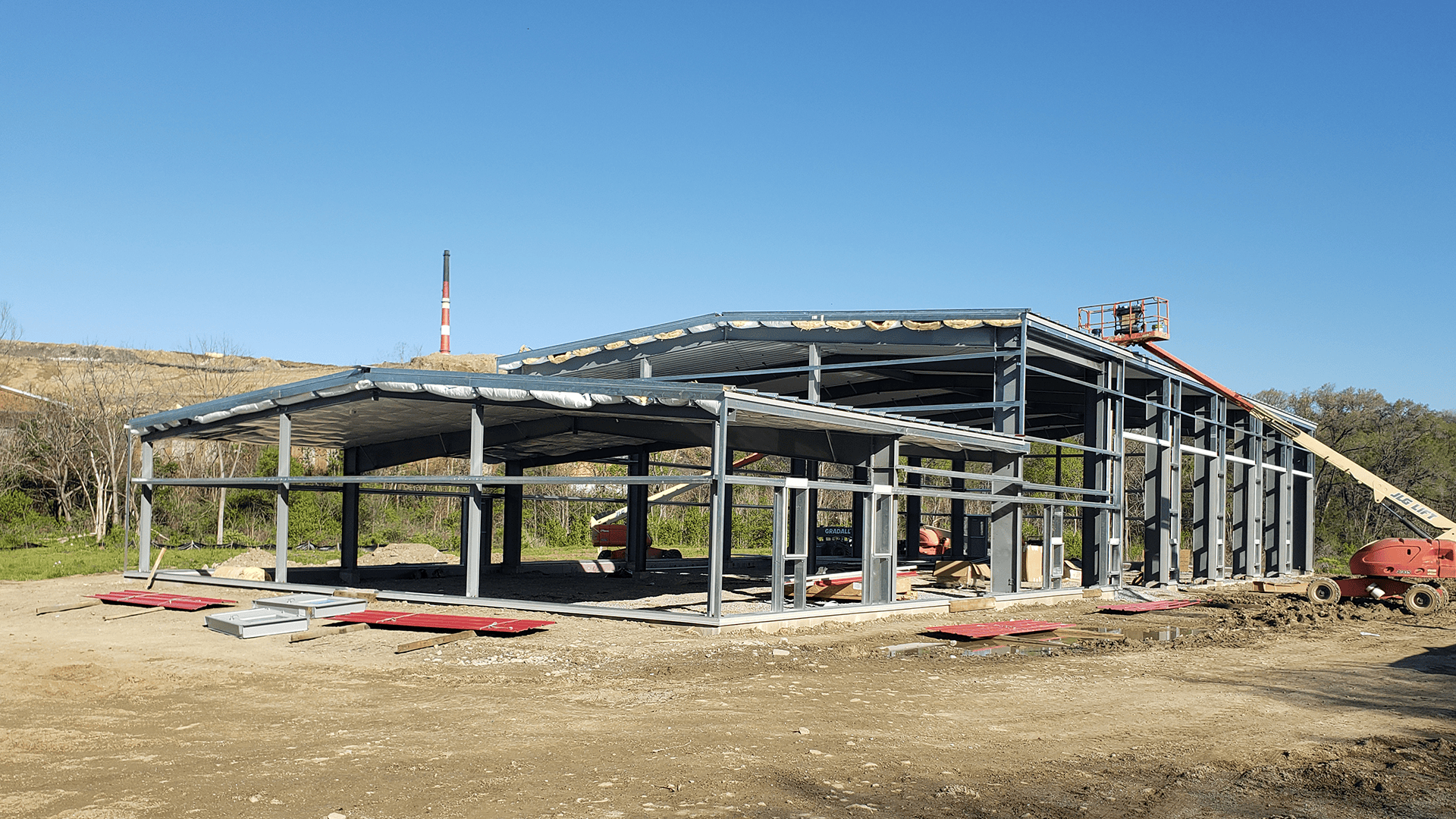 Red Direct modern steel construction innovation featuring a pre-engineered steel building with clear-span design and energy-efficient construction