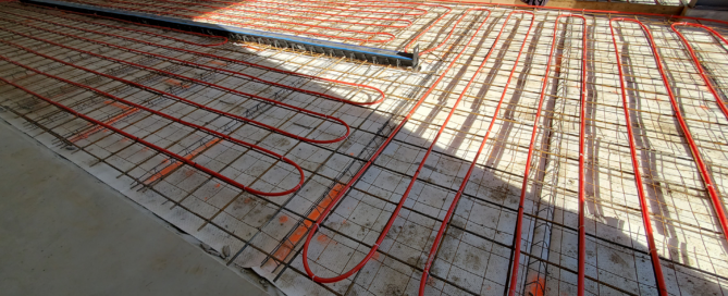 Red Direct steel building supporting renewable energy operations beside a solar panel installation