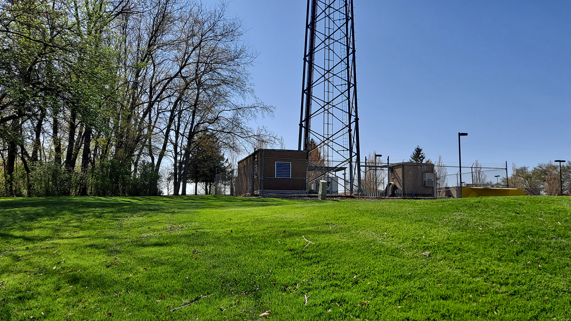 Steel energy infrastructure facility with metal cladding, energy-efficient systems, and surrounding industrial equipment